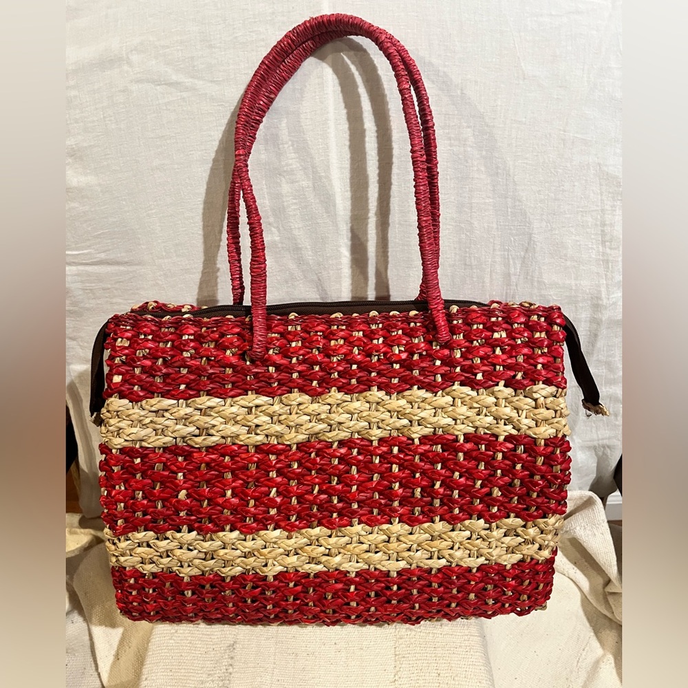 Red And Beige Hand Woven Straw Tote Bag With Zip Closure.